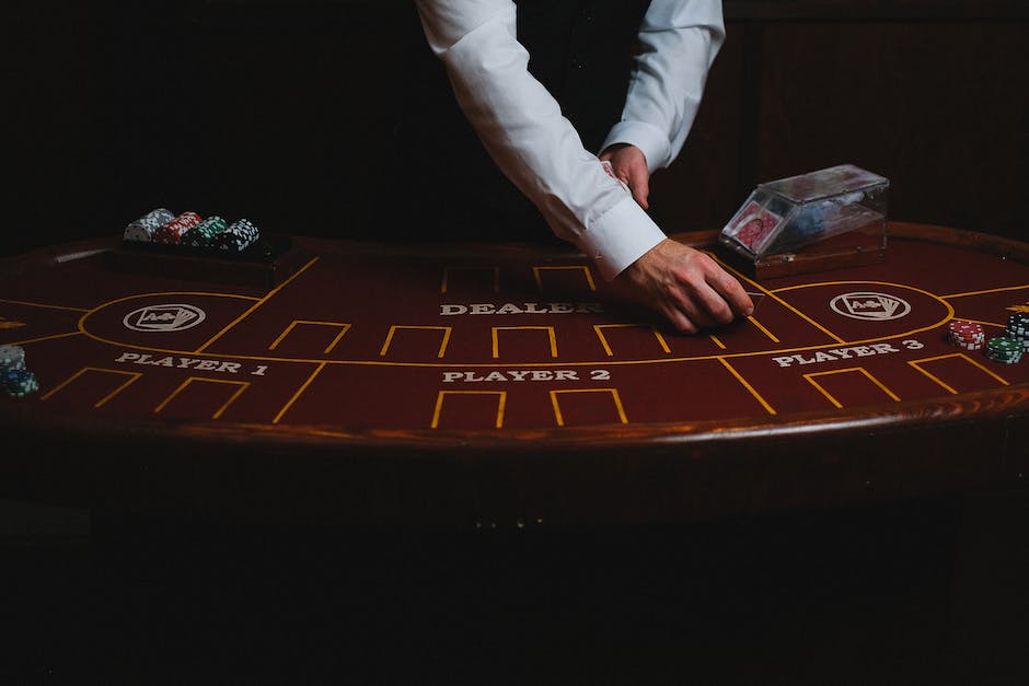 An image showing a person playing blackjack in a casino.