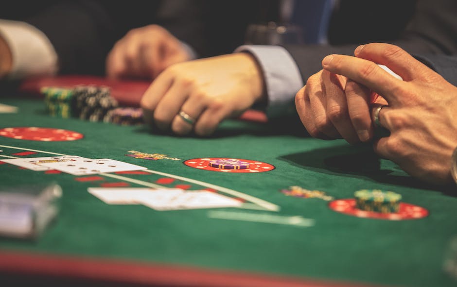 Image depicting a person at a casino table, looking disappointed and frustrated with money flying away from the table.
